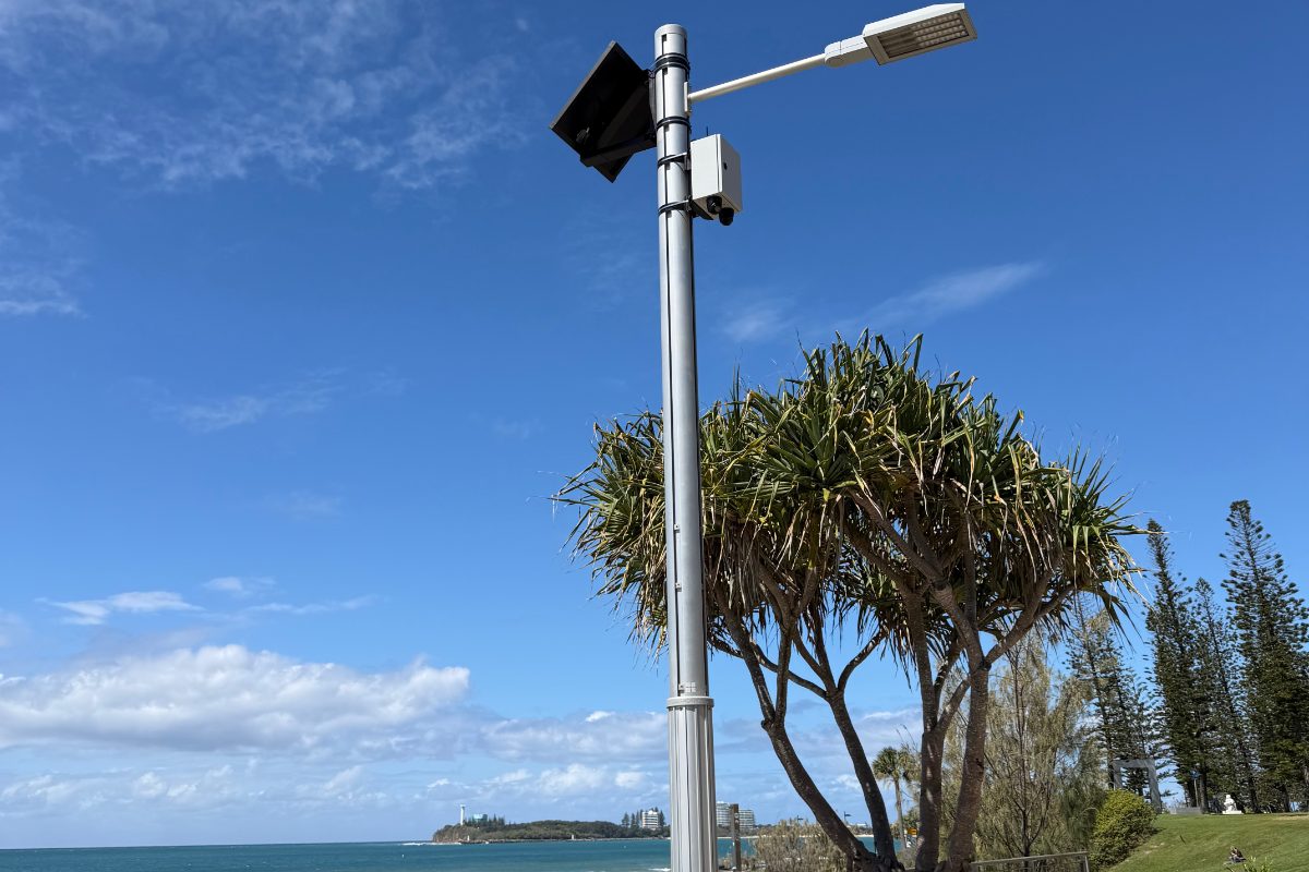 NDAA-compliant solar CCTV system fitted to a council light pole on a beachfront foreshore